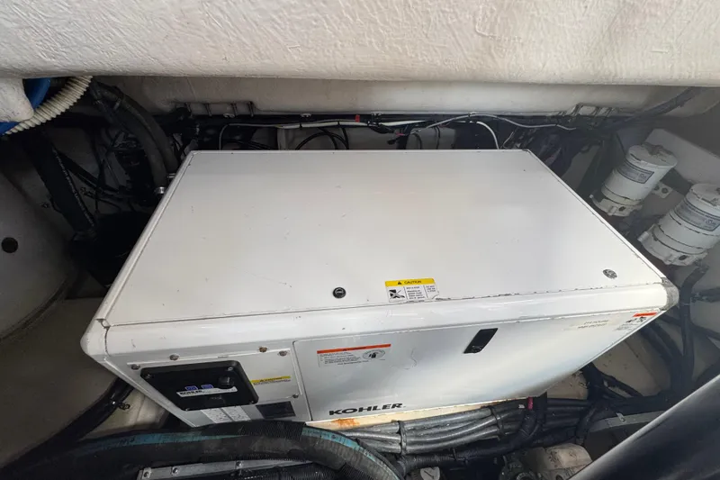 Slide: The Image of Engine room of 2016 Sea Ray 400 Sundancer with Kohler generator. - 47