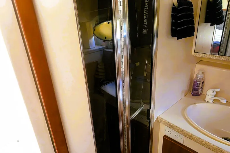 Slide: The Image of Bathroom interior of 1998 Silverton 352 Motor Yacht with sink and shower. - 18