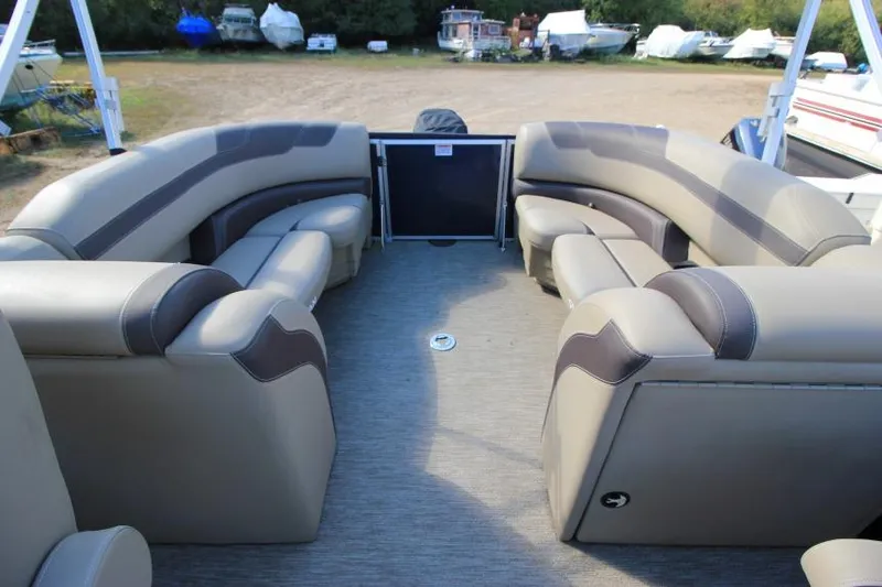 Slide: The Image of 2022 Sylvan L3 LZ pontoon boat interior with spacious seating and modern design. - 10