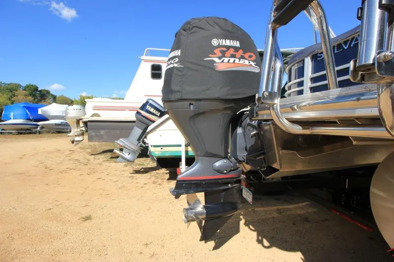 Slide: The Image of 2022 Sylvan L3 LZ boat with Yamaha SHO VMAX outboard motor on sandy shore. - 5