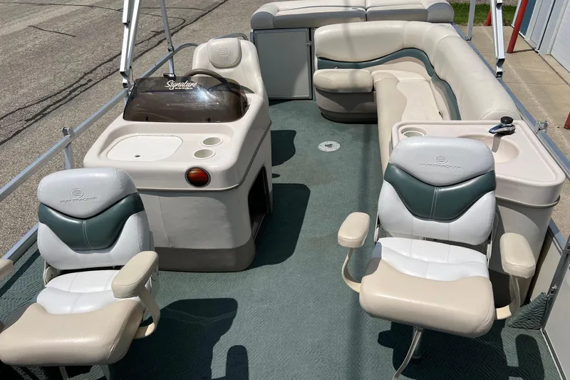 Slide: The Image of 2006 Sun Tracker Party Barge 24 interior with seating and helm station. - 19