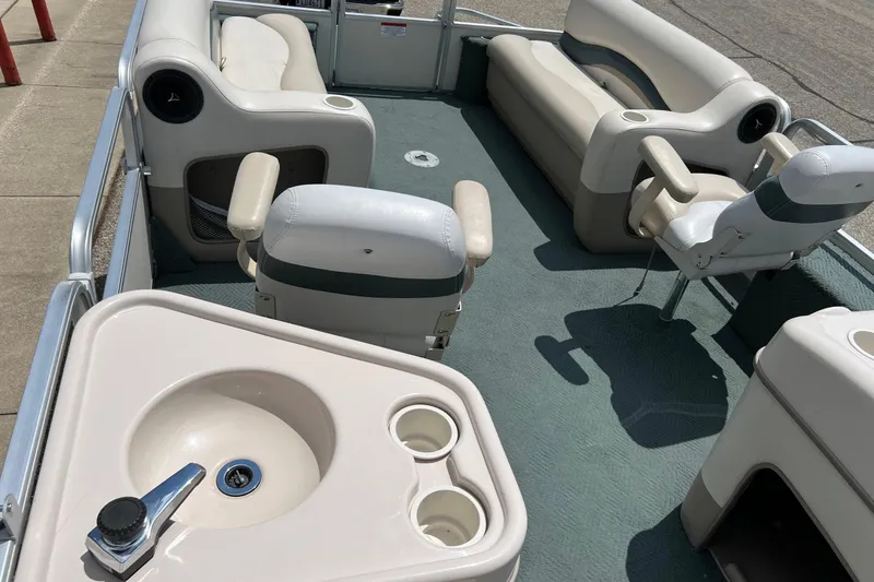 Slide: The Image of 2006 Sun Tracker Party Barge 24 interior with seating and sink. - 20