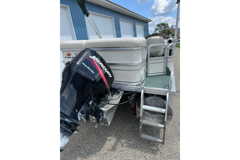Slide: The Image of 2006 Sun Tracker Party Barge 24 with Mercury FourStroke engine, rear view. - 28