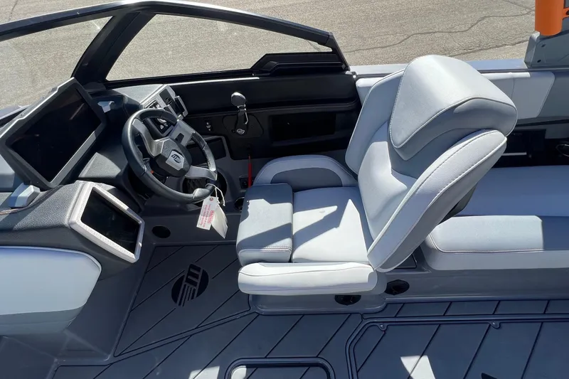Slide: The Image of 2023 Malibu Wakesetter 22 LSV interior with modern dashboard and comfortable seating. - 17