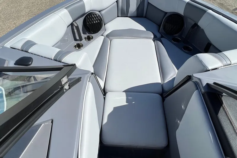 Slide: The Image of 2023 Malibu Wakesetter 22 LSV interior with gray seating and cup holders. - 22