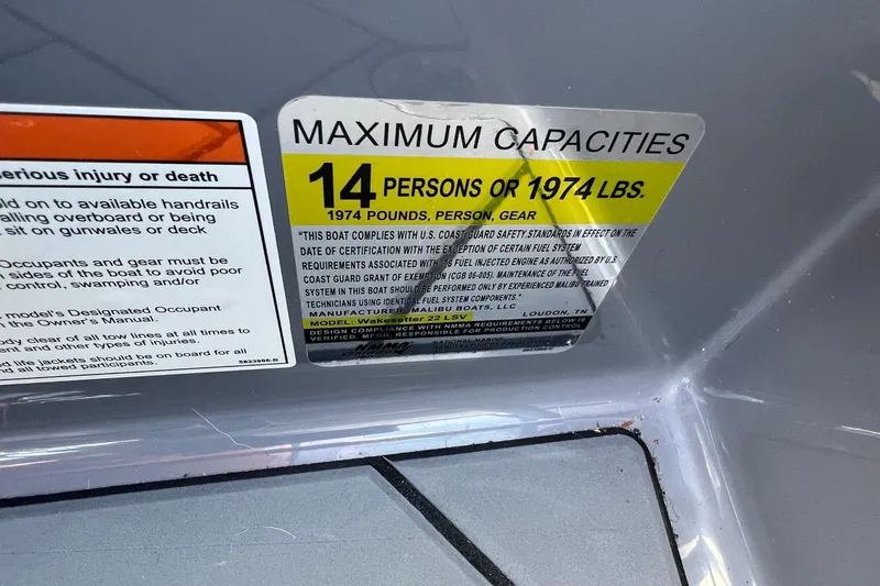 Slide: The Image of 2023 Malibu Wakesetter 22 LSV capacity label: 14 persons or 1974 lbs maximum. - 28