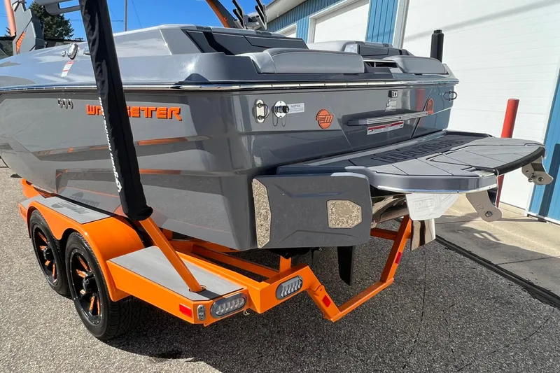 Slide: The Image of 2023 Malibu Wakesetter 22 LSV boat on orange trailer, rear view. - 37