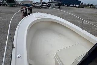 Slide: The Image of 2001 Parker 2100 Special Edition boat, white deck, docked in a marina. - 4
