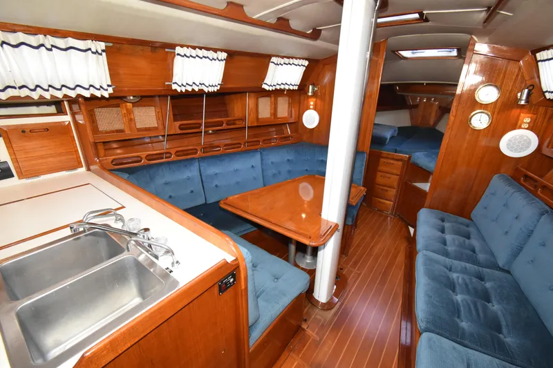 Slide: The Image of Interior of 1988 Ericson 38-200 sailboat with wood finish and blue upholstery. - 10