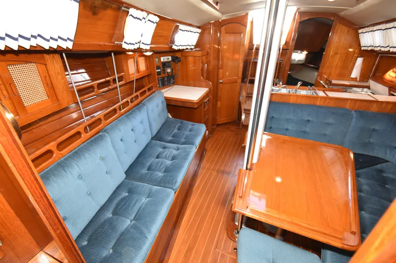 Slide: The Image of Interior of 1988 Ericson 38-200 sailboat with wood finish and blue upholstery. - 12