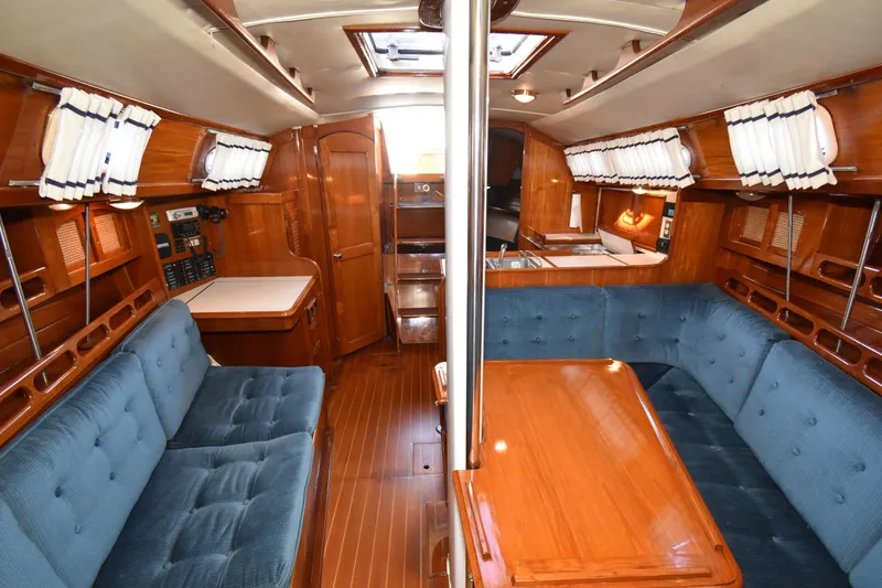Slide: The Image of Interior of 1988 Ericson 38-200 sailboat with wood finish and blue upholstery. - 13
