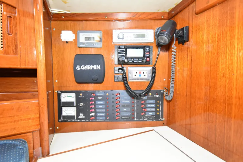 Slide: The Image of Control panel of a 1988 Ericson 38-200 sailboat with navigation and communication equipment. - 22