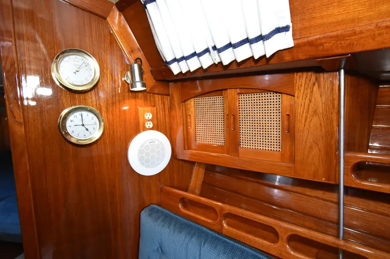 Slide: The Image of Interior of 1988 Ericson 38-200 sailboat with wood paneling, gauges, and speaker. - 26