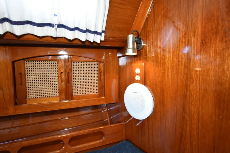 Slide: The Image of Interior of 1988 Ericson 38-200 sailboat with wood paneling and speaker. - 27