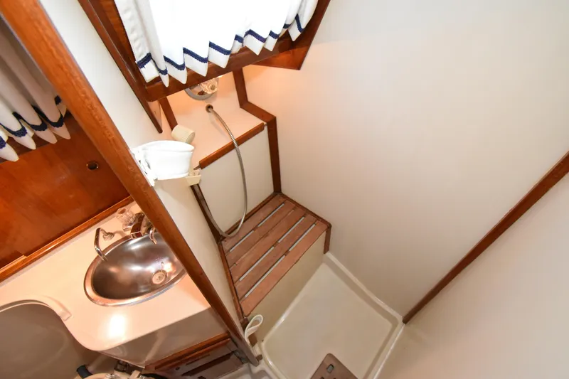 Slide: The Image of Compact bathroom in 1988 Ericson 38-200 sailboat with sink and shower. - 35