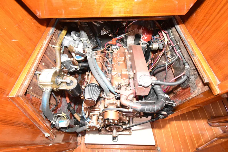 Slide: The Image of Engine compartment of a 1988 Ericson 38-200 sailboat, showcasing detailed mechanical components. - 36