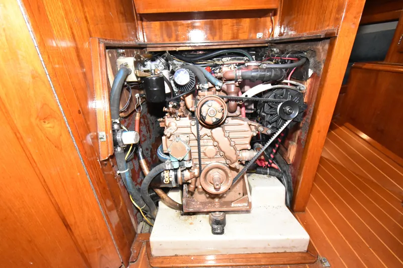 Slide: The Image of Engine compartment of a 1988 Ericson 38-200 sailboat, showcasing detailed mechanical components. - 37