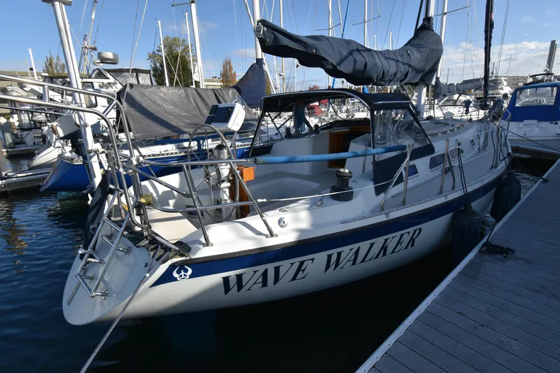 Slide: The Image of 1988 Ericson 38-200 sailboat "Wave Walker" docked at marina. - 42