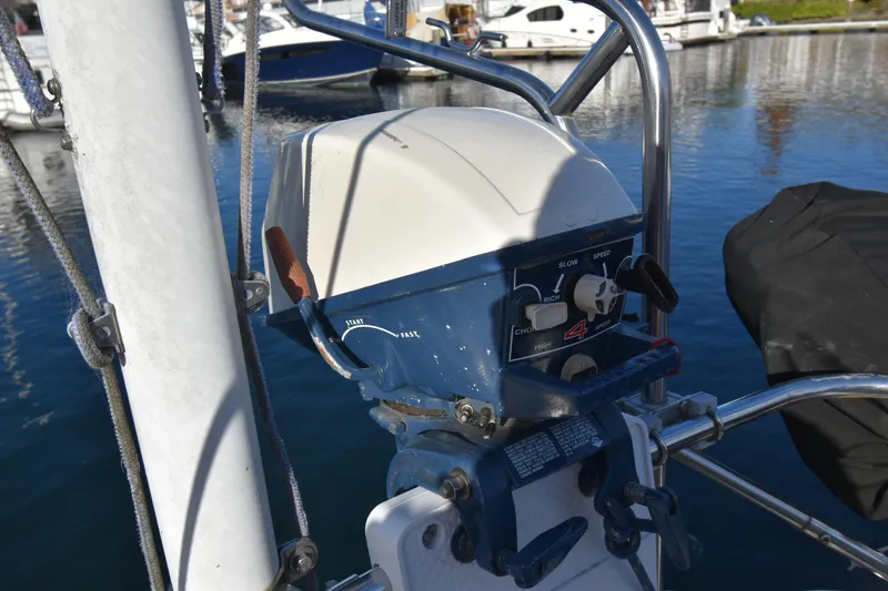 Slide: The Image of 1988 Ericson 38-200 sailboat control panel at marina, featuring speed and choke settings. - 47