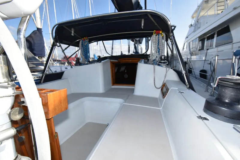 Slide: The Image of Cockpit of 1988 Ericson 38-200 sailboat with ropes and winches, docked at marina. - 61