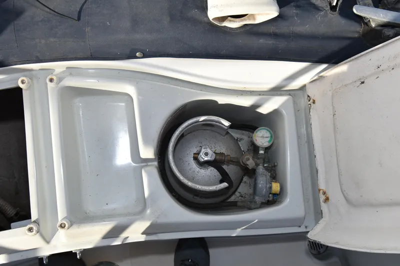 Slide: The Image of Propane tank compartment on a 1988 Ericson 38-200 sailboat, featuring a pressure gauge. - 68