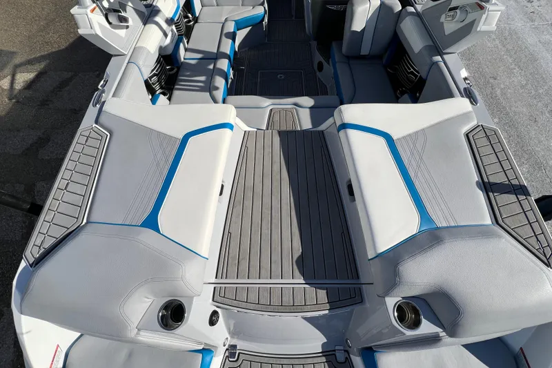 Slide: The Image of 2020 Super Air Nautique G21 boat interior with gray and blue seating. - 14