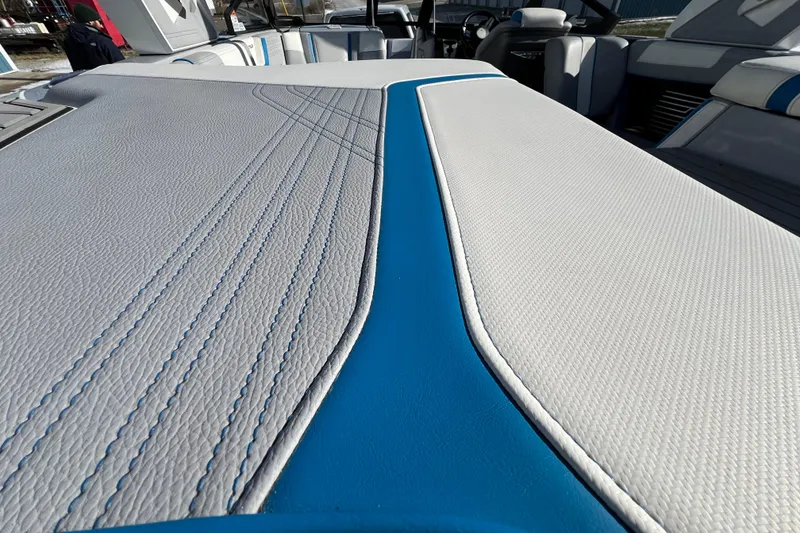 Slide: The Image of 2020 Super Air Nautique G21 interior with blue and white upholstery detail. - 15