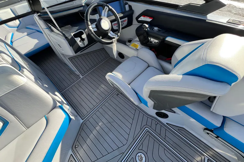 Slide: The Image of 2020 Super Air Nautique G21 interior with sleek design and modern steering wheel. - 20