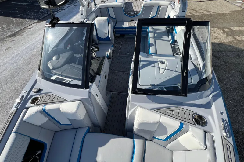 Slide: The Image of 2020 Super Air Nautique G21 boat interior with sleek seating and modern design. - 28