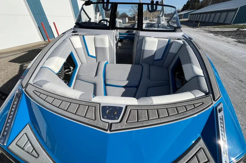 Slide: The Image of 2020 Super Air Nautique G21 boat with blue and white interior seating. - 5