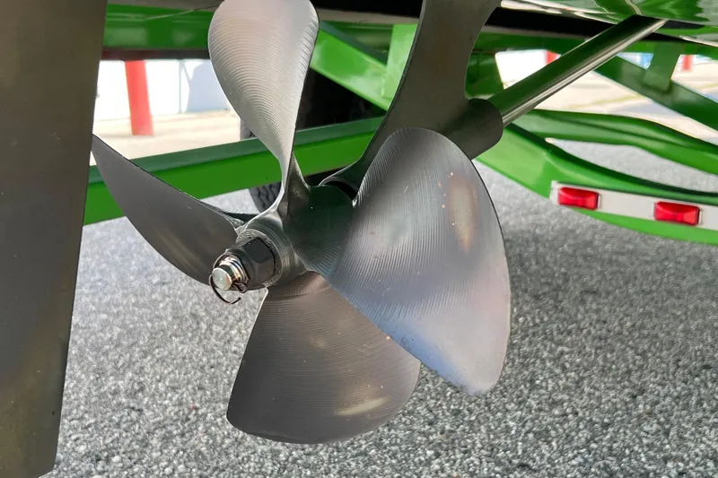 Slide: The Image of Close-up of a 2003 MasterCraft X-5 boat propeller on a green trailer. - 10