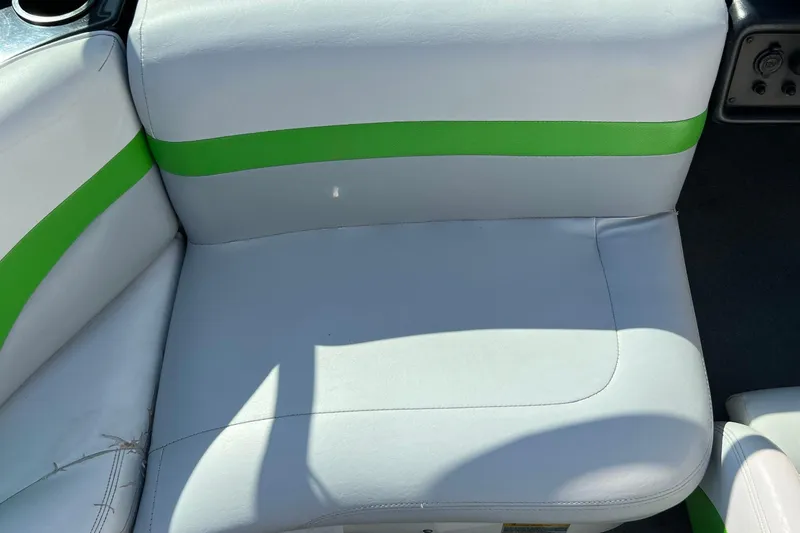 Slide: The Image of 2003 MasterCraft X-5 boat seat with green and white upholstery. - 21