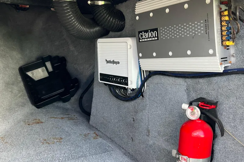 Slide: The Image of 2003 MasterCraft X-5 interior with Clarion Marine amplifier and fire extinguisher. - 22