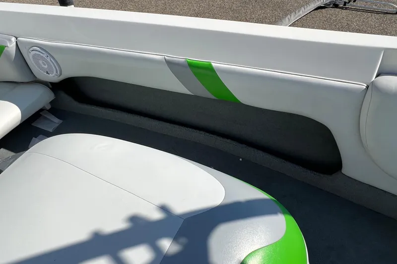 Slide: The Image of 2003 MasterCraft X-5 boat interior with green accents and speaker detail. - 23