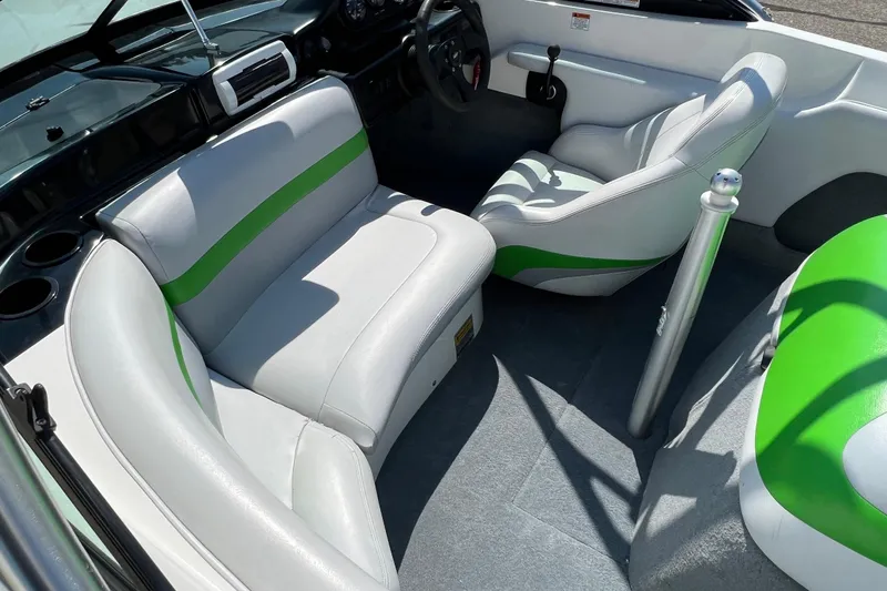Slide: The Image of 2003 MasterCraft X-5 boat interior with white and green seating. - 4