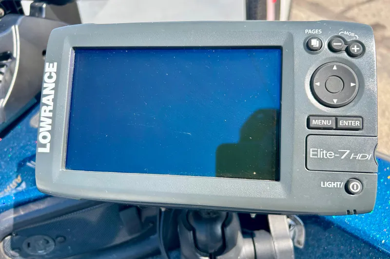 Slide: The Image of 2005 Skeeter WX1880 DC boat interior with gray carpeted deck and metal pole. - 15