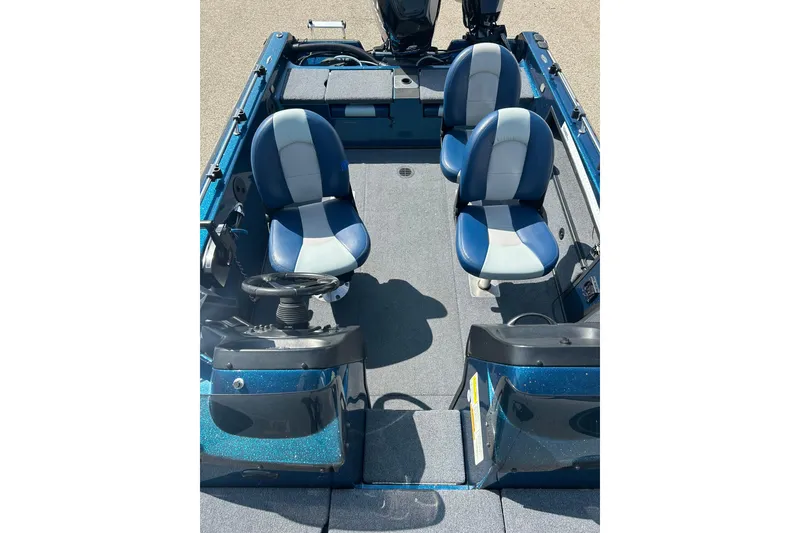 Slide: The Image of Open storage compartment on 2005 Skeeter WX1880 DC boat with visible wiring. - 17