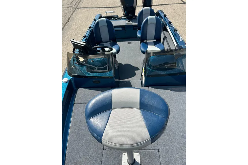 Slide: The Image of Open storage compartment in 2005 Skeeter WX1880 DC boat, featuring carpeted interior. - 18