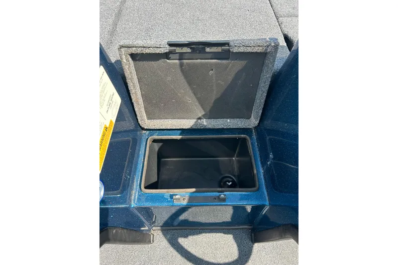 Slide: The Image of Open storage compartment in 2005 Skeeter WX1880 DC boat, showing interior details. - 19