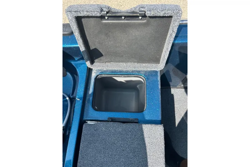 Slide: The Image of 2005 Skeeter WX1880 DC boat interior with blue seats and gray carpet. - 20