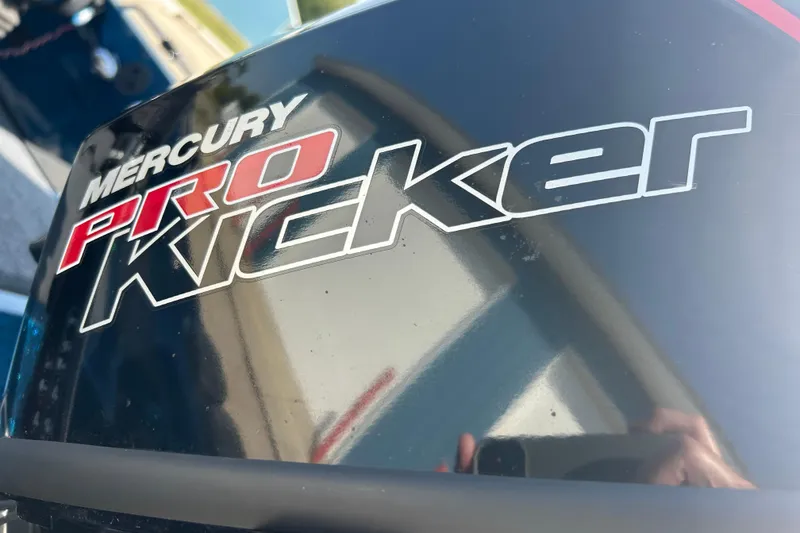 Slide: The Image of 2005 Skeeter WX1880 DC boat with open storage compartment, blue finish. - 24