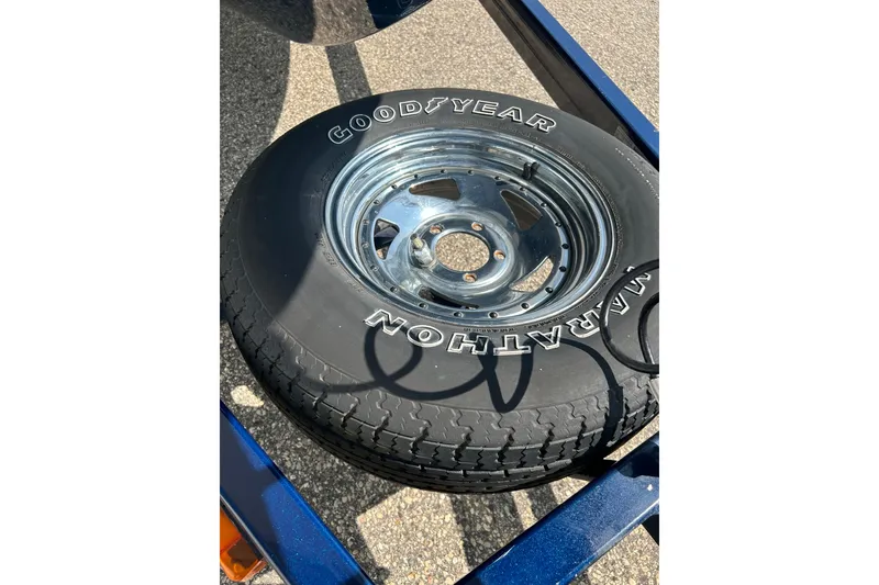 Slide: The Image of Black i-Pilot remote control on gray carpet, featuring multiple buttons and a display screen. - 37