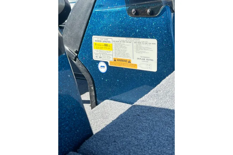 Slide: The Image of 2005 Skeeter WX1880 DC boat label showing capacity and safety information. - 45