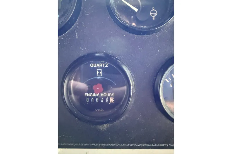 Slide: The Image of Close-up of Carver 390 yacht engine hour meter showing 648 hours. - 15
