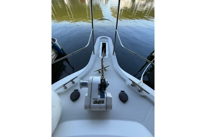 Slide: The Image of Bow of 1993 Carver 390 Cockpit Motor Yacht with anchor chain and winch. - 17