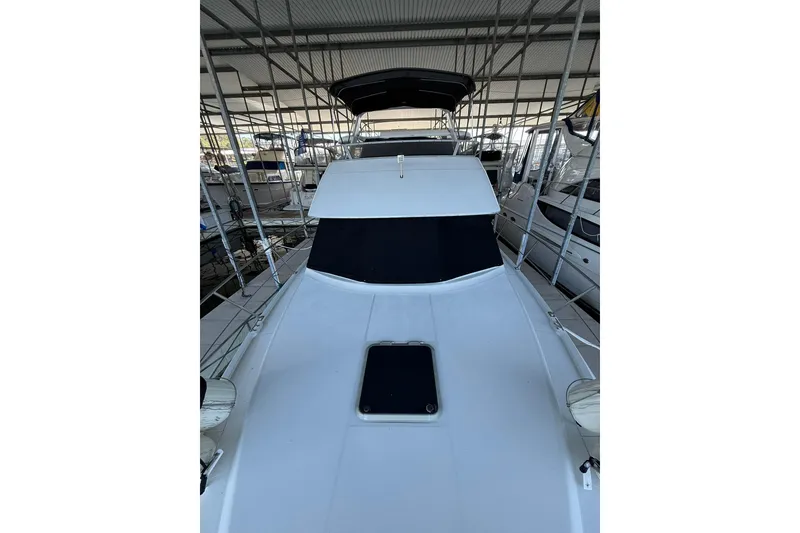 Slide: The Image of 1993 Carver 390 Cockpit Motor Yacht in marina, view of deck and cockpit area. - 18