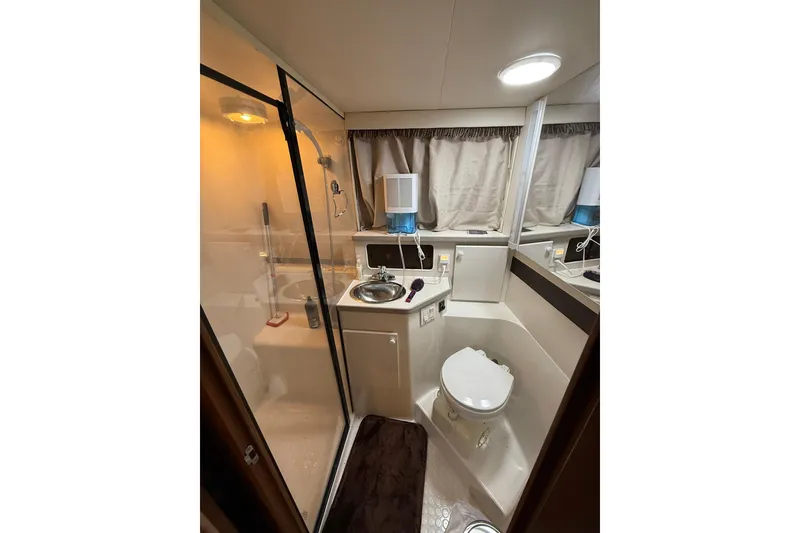 Slide: The Image of Bathroom interior of 1993 Carver 390 Cockpit Motor Yacht with shower and sink. - 28