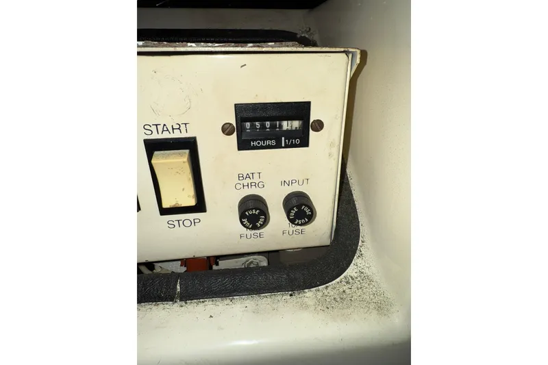 Slide: The Image of Control panel of 1993 Carver 390 Cockpit Motor Yacht with hour meter and switches. - 32