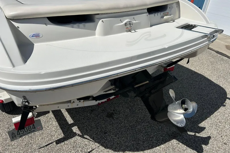 Slide: The Image of Rear view of a 2005 Sea Ray 200 Sport boat with propeller and license plate. - 13