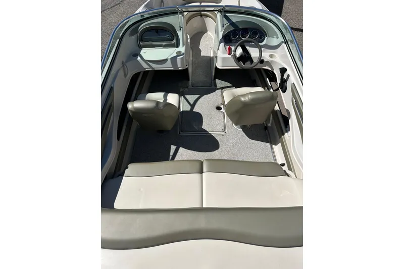 Slide: The Image of 2005 Sea Ray 200 Sport boat interior with seating and dashboard view. - 15